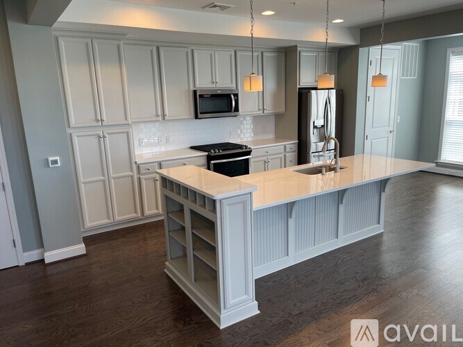 A kitchen with a large island in the middle.