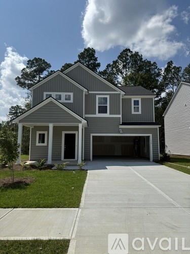 A two-story house with a garage is shown in the image.