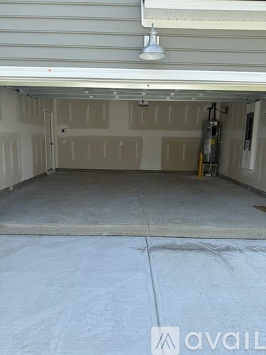 A garage with a white ceiling and a concrete floor.