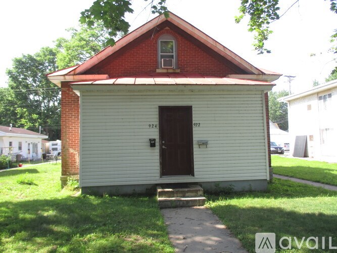 A small white church with a red roof is for sale.