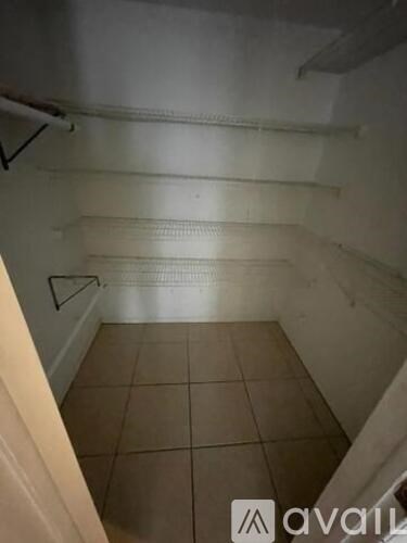 A room with a tiled floor and white walls.