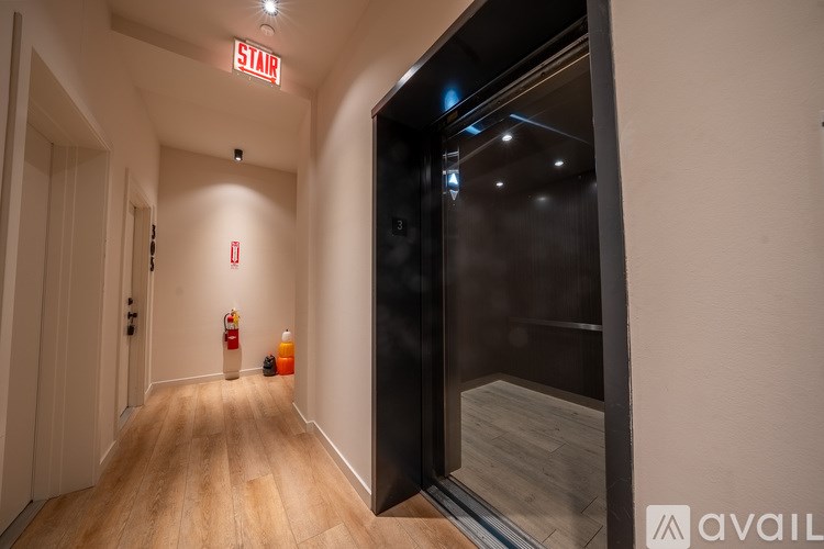 A hallway with a red sign that says "STAIR" on the top.