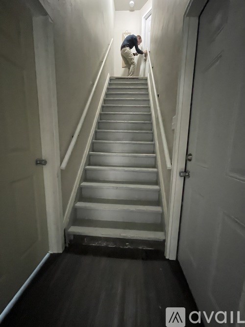 A man is climbing a staircase.