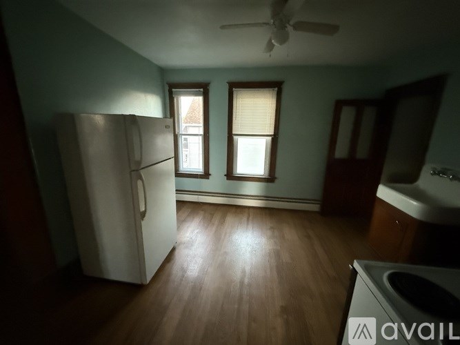 A field of yellow flowers with a sunset in the background.