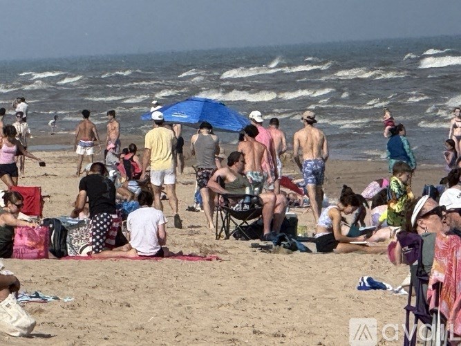 A group of people are enjoying a sunny day at the beach.