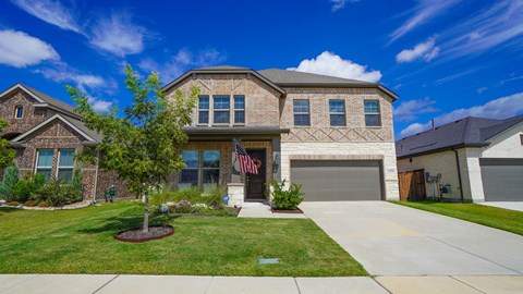 A house with a flag on the front porch.