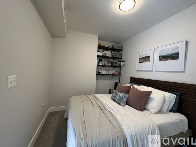 A row of ovens are lined up in a room.