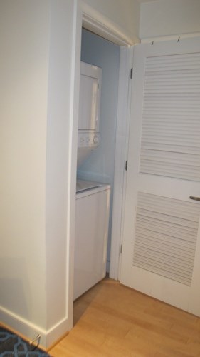 A white door with a white frame is open.