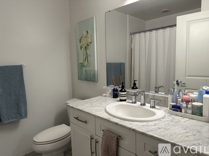 A black and white floor plan of a house with a living room, dining room, kitchen, and bathroom.