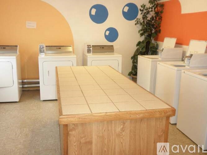 A row of washing machines in a laundromat.
