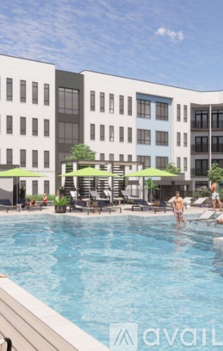 A pool in front of a building with people in it.