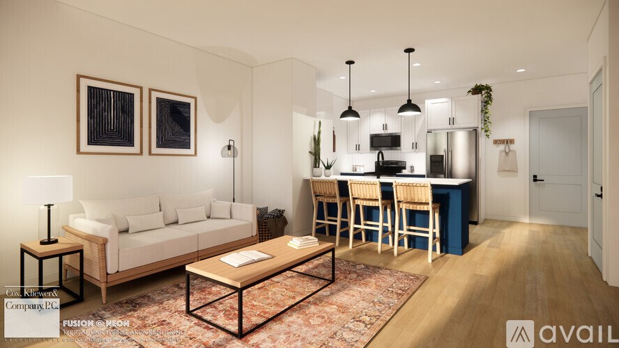 A modern living room with a white sofa, a coffee table, and a kitchen area in the background.