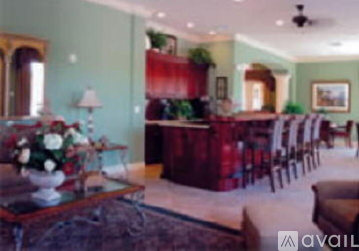 A living room with a red couch and a coffee table.