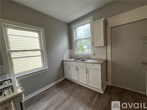 A kitchen with a window and a sink.