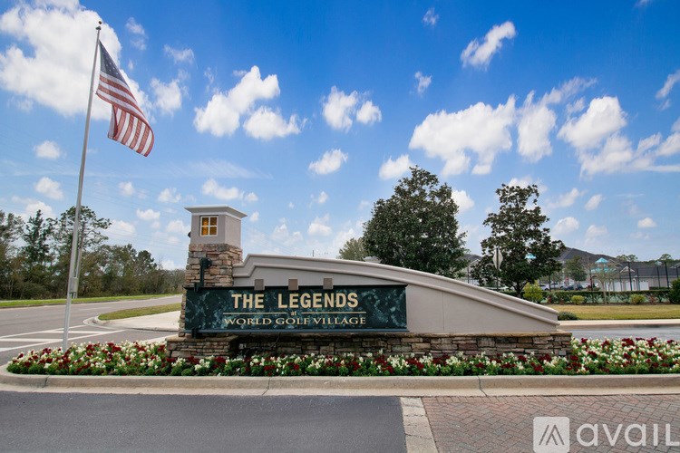 The entrance to The Legends World Golf Village with a flag flying in the background.