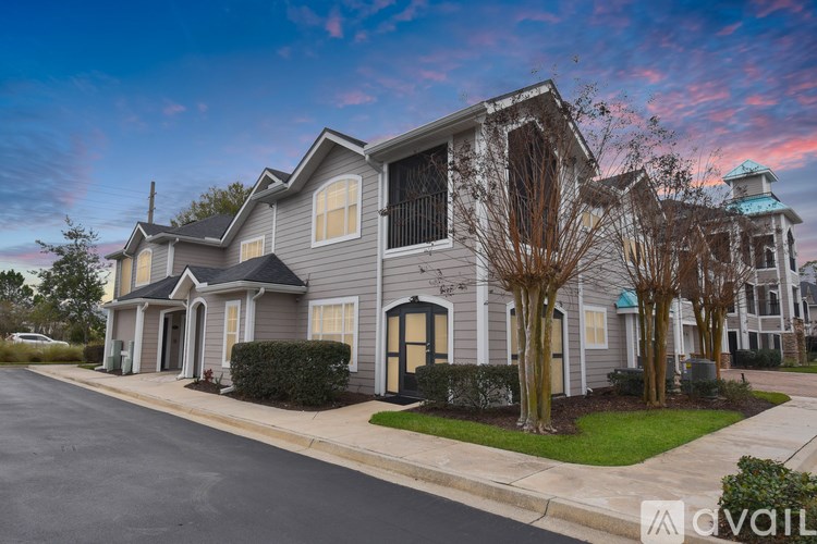 A row of houses with a sign that says "available" in front of them.
