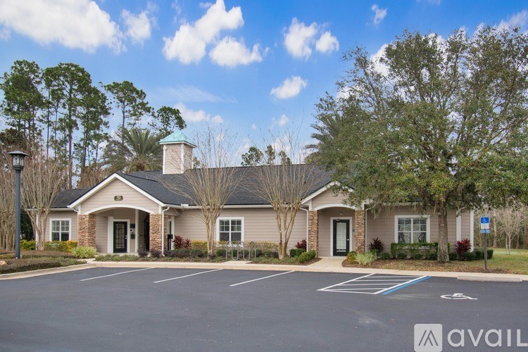 A building with a parking lot in front of it.