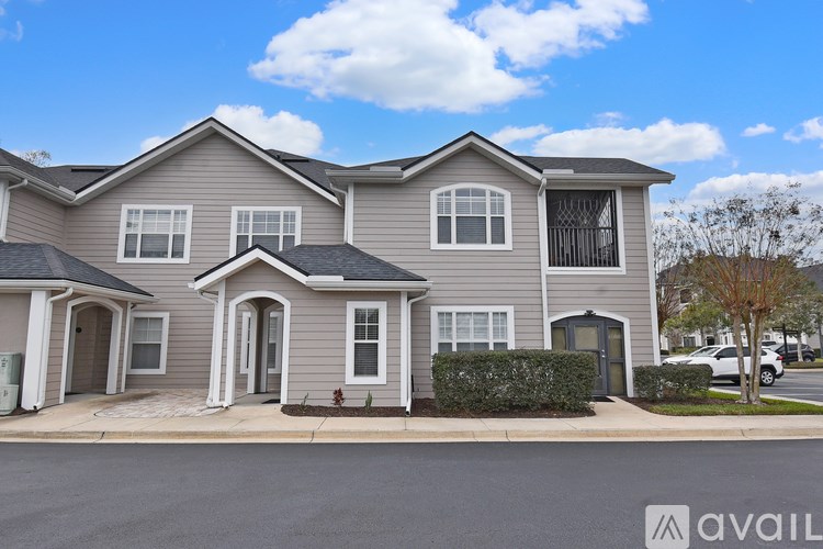 A row of houses with a sign that says "available" in front of them.