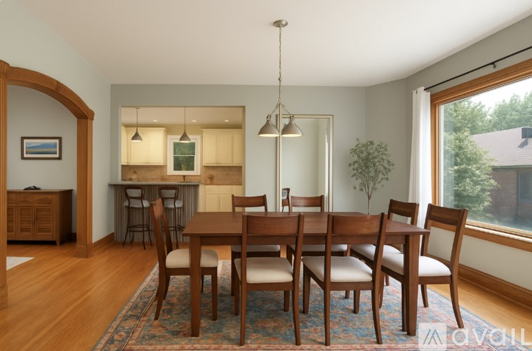A dining room with a table set for six.