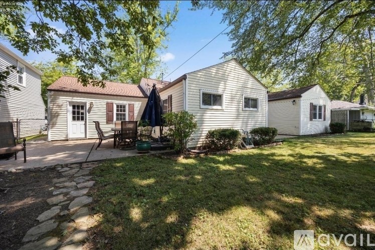 A house with a patio and a lawn.