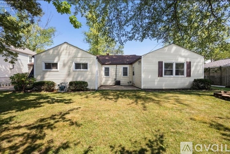 A house with a lawn in front of it is for sale.