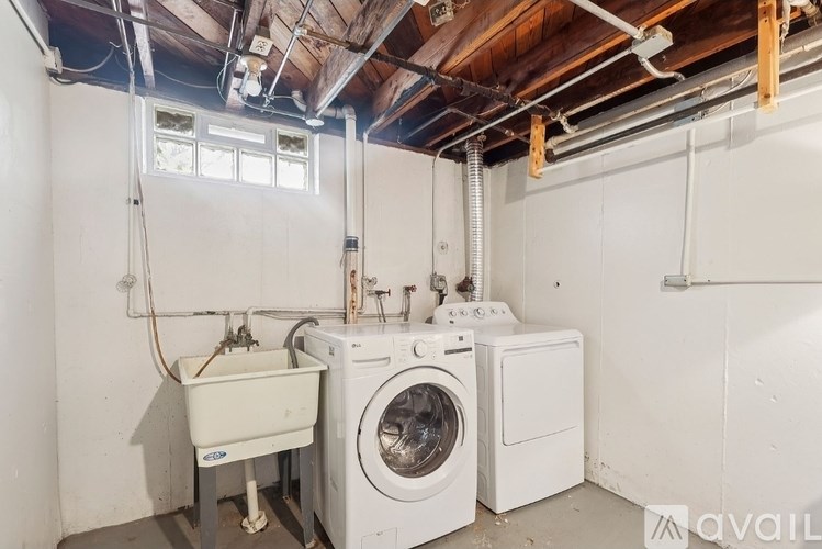A laundry room with a washer and dryer.