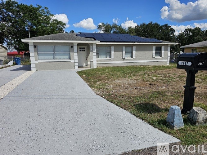 A house with a driveway in front of it.
