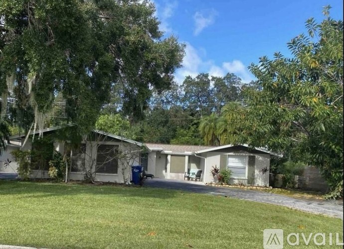 A house with a tree in front of it.