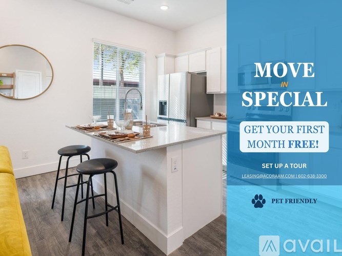 A kitchen with a bar area and a sign offering a free first month.