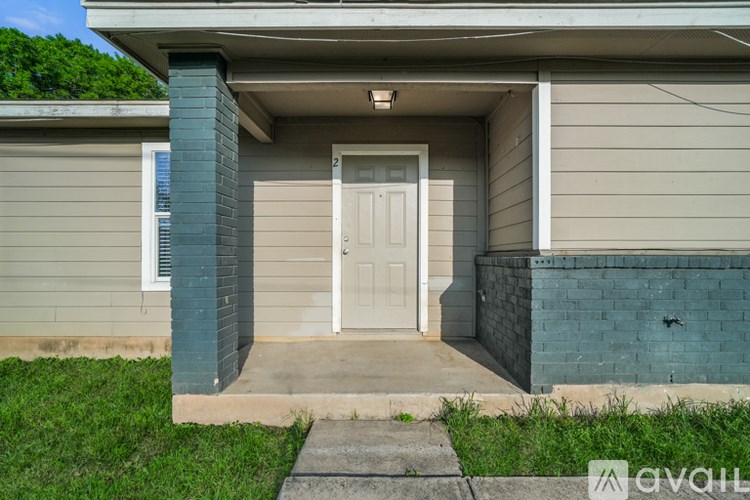 A house with a white door and a small porch.