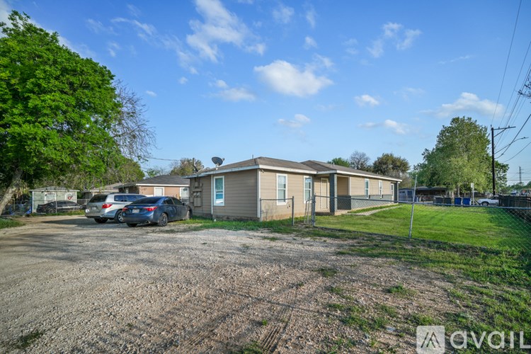 A house with a car parked in front of it.