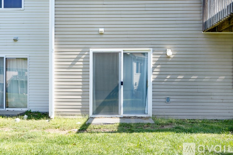 A house with a white door and windows.