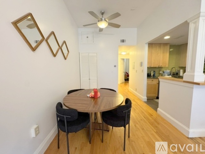 A kitchen with wooden cabinets and a white counter.