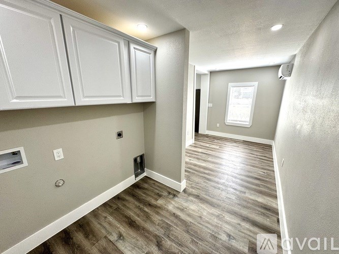 A floor plan of a small apartment with two bedrooms and a living room.