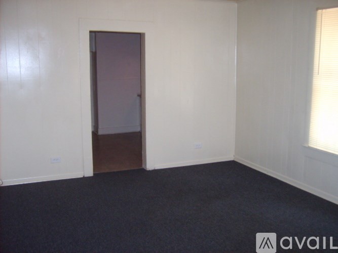 A room with a door and a window.