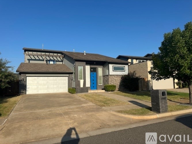A house with a blue door is for sale.