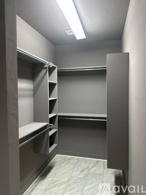 A row of empty shelves in a storage room.