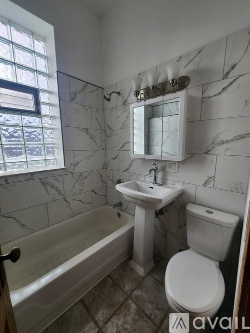 Empty shelves in a room with a white wall.