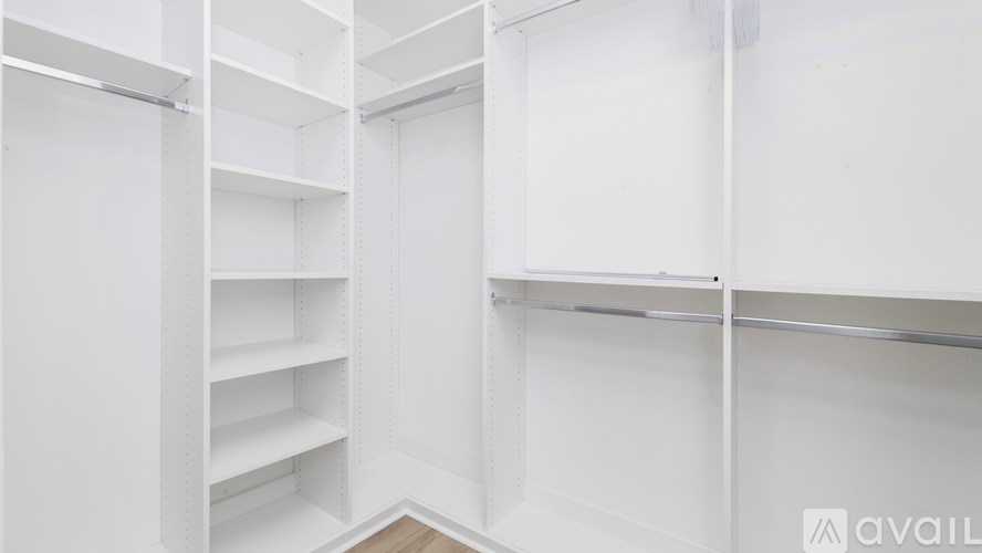 Empty white shelves in a room.