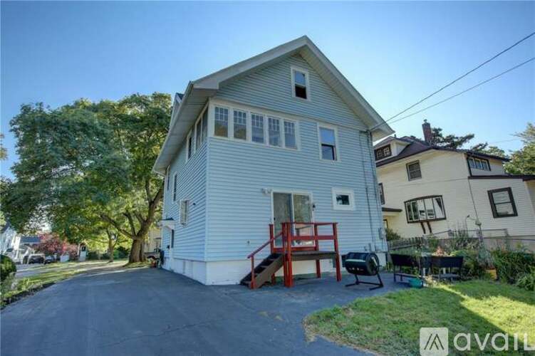 A house with a blue exterior is for sale.