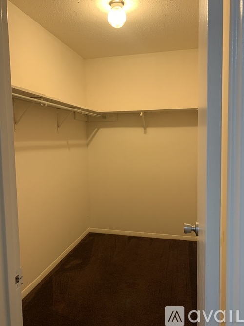A small, empty room with a light on.