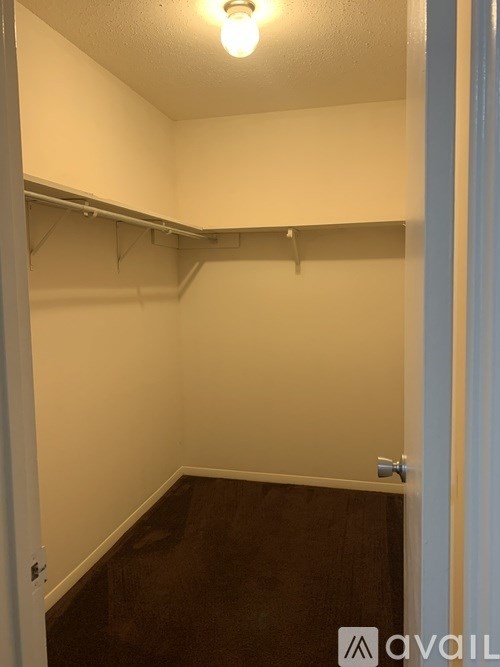 A small, empty room with a light on.