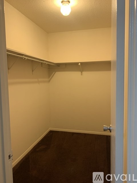 A small, empty room with a light on.