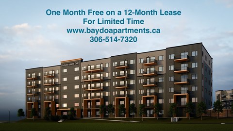 A building with a sign offering a free month on a lease.