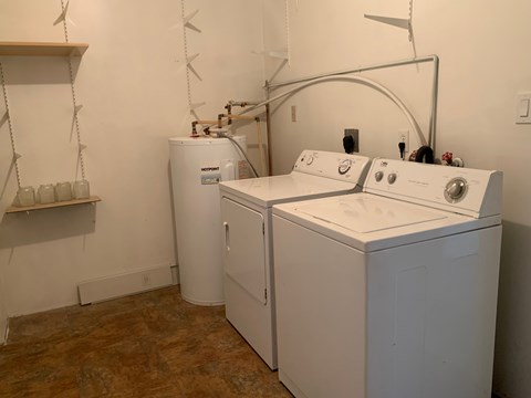 A laundry room with a washer and dryer.