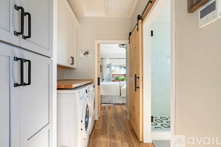 A laundry room with a washer and dryer.