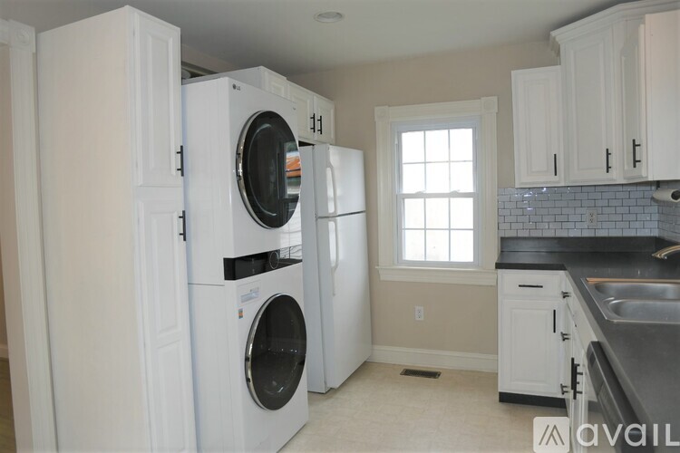 A laundry room with a washer and dryer in it.