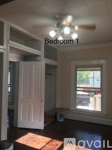Bedroom 1 has a window and a door.