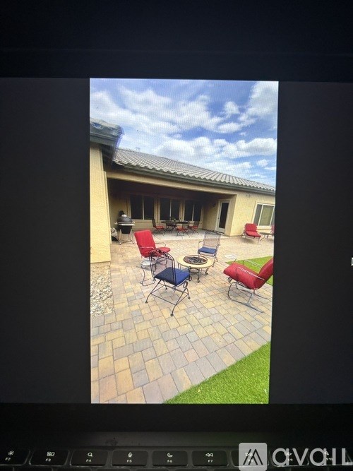 A patio with a table and chairs is shown.