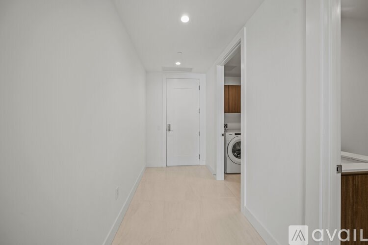 A long hallway with a door at the end.